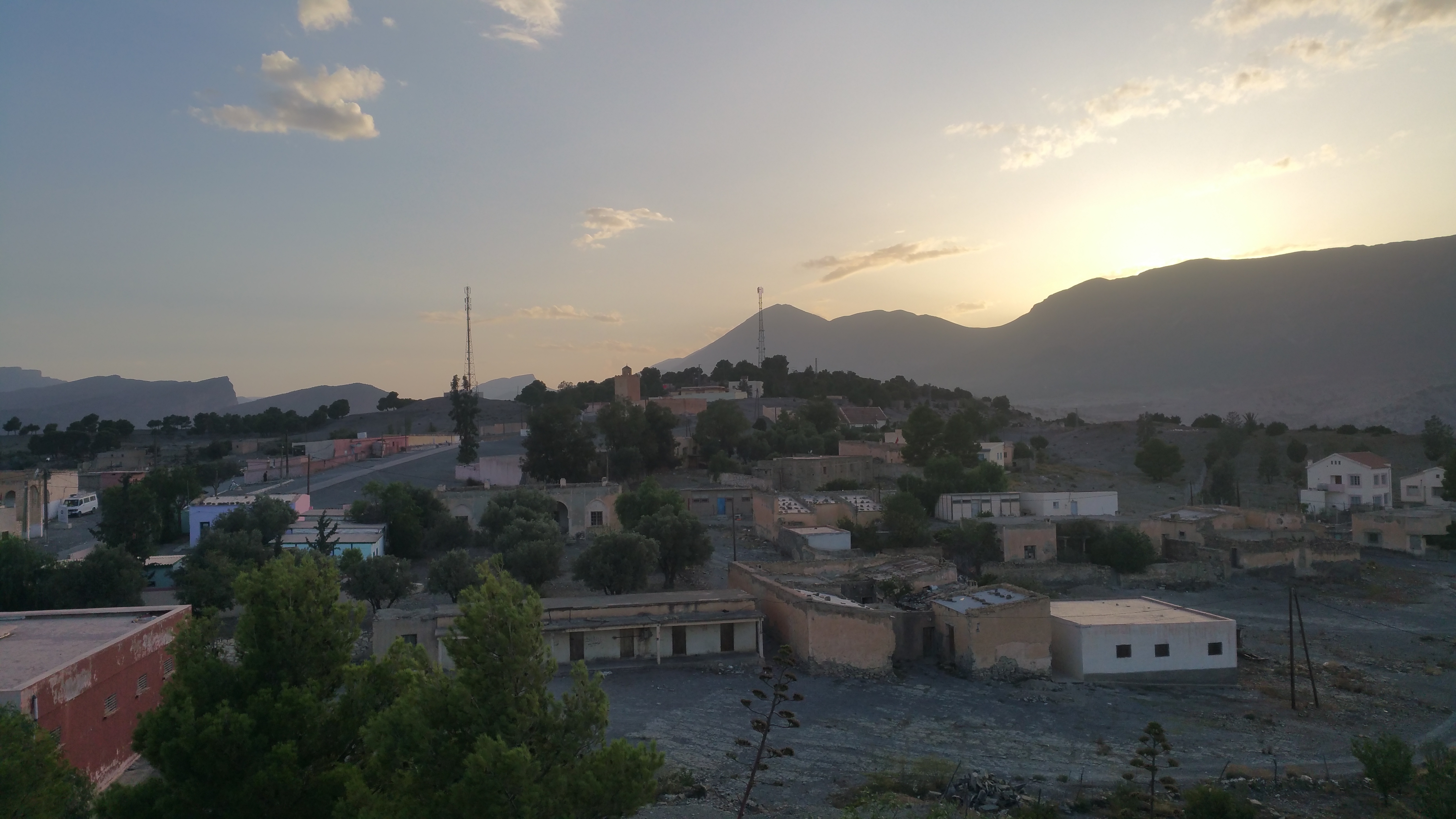 Berkine village beneath the mountains at sunset